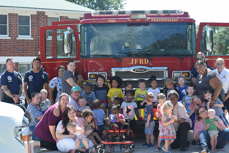 Kids Sharing with Firemen